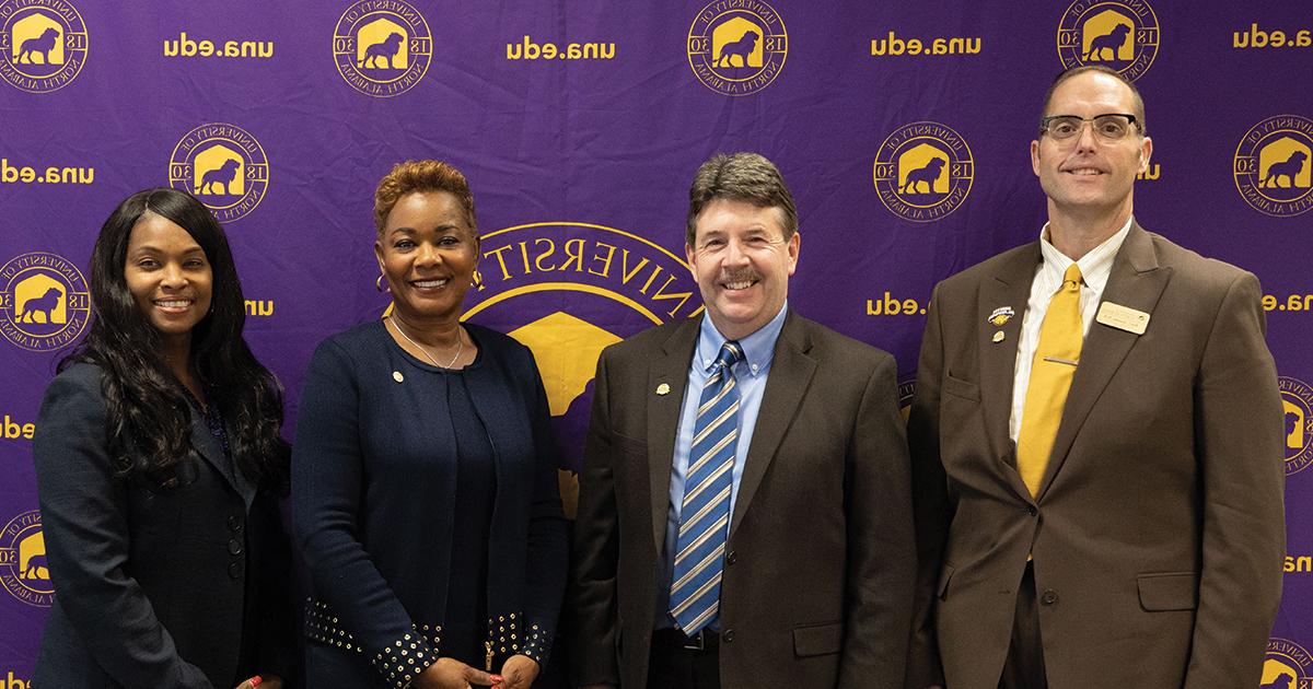 President Ken Kitts and Provost and Executive Vice President for Academic Affairs Ross Alexander pose with Drake State Community and Technical College President Patricia Sims. 